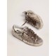 Super-Star sneakers in platinum-colored glitter with star and heel tab in tone-on-tone laminated leather
