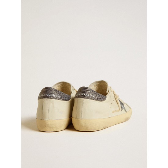 Super-Star LTD with cream-colored leather star with Swarovski crystals and blue leather heel tab with lizard print