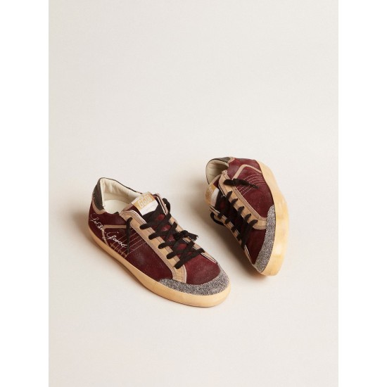 Women’s Super-Star Penstar LAB in burgundy suede with perforated star