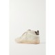 Superstar distressed shearling-lined rubber and leather sneakers