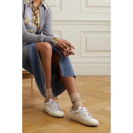 Superstar distressed embroidered textured-leather sneakers