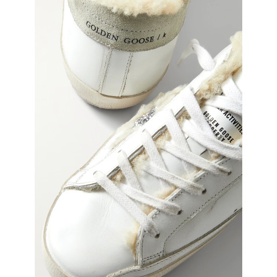 Superstar shearling-lined distressed glittered leather sneakers