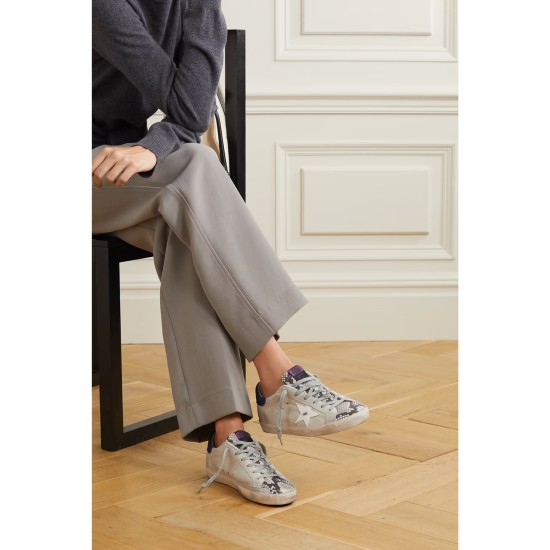 Superstar denim-trimmed distressed snake-effect leather and suede sneakers